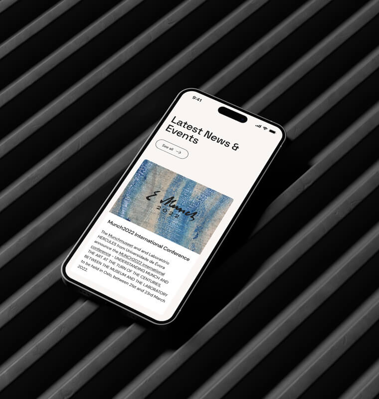 Smartphone with HERCULES Laboratory website on iron bars.