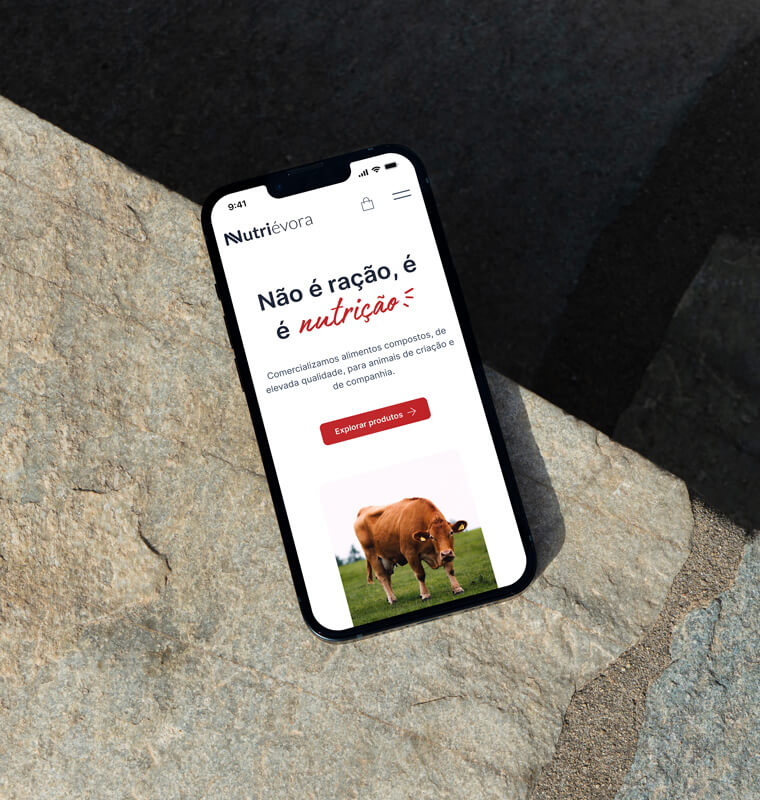Smartphone with nutrievora website on concrete floor.